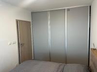 Łóżko lub łóżka w pokoju w obiekcie Apartment Sun Lakes - Sever