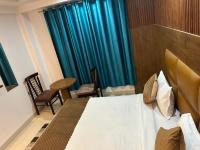 Hotel Air City Near Delhi Aiportにあるベッド