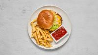 a plate with a sandwich and french fries and ketchup at Luxury Downtown Dallas Stay by Amyfinehouse in Dallas