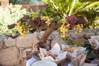 a bunch of grapes and crackers on a table at Hotel restaurant Xalet la Coromina in Viladrau