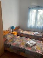 A bed or beds in a room at Comfortable Apartment Near The Sea