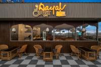 a restaurant with chairs and a sign on the front of it at Hari Om Residency 200 Meters From Ram Mandir Ayodhya in Ayodhya
