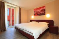 Postel nebo postele na pokoji v ubytování Hotel Elvezia Ascona