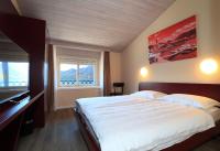 Postel nebo postele na pokoji v ubytování Hotel Elvezia Ascona