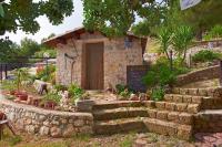 A garden outside B&B La Scapola