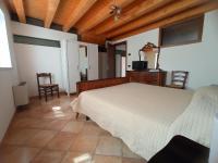 Posteľ alebo postele v izbe v ubytovaní Agriturismo Corte Maccini