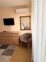 Televízia a/alebo spoločenská miestnosť v ubytovaní Ante Apartment