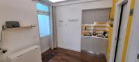 Televízia a/alebo spoločenská miestnosť v ubytovaní Sorrento Punto It Apartment