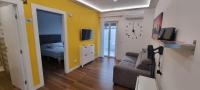 Televízia a/alebo spoločenská miestnosť v ubytovaní Sorrento Punto It Apartment