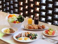 a table topped with plates of breakfast foods and drinks at GLAD Yeouido in Seoul