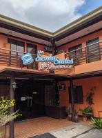 a building with a sign for a sushi sucker restaurant at Sonly Hotel in General Santos