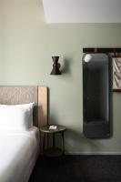 Ein Bett oder Betten in einem Zimmer der Unterkunft Alex Hotel