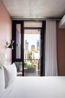 Ein Bett oder Betten in einem Zimmer der Unterkunft Alex Hotel