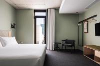 Ein Bett oder Betten in einem Zimmer der Unterkunft Alex Hotel