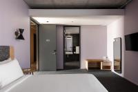 Ein Bett oder Betten in einem Zimmer der Unterkunft Alex Hotel