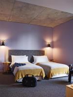 Ein Bett oder Betten in einem Zimmer der Unterkunft Alex Hotel
