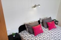 Posteľ alebo postele v izbe v ubytovaní Lucsony Apartman