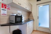 Kuchyňa alebo kuchynka v ubytovaní Lucsony Apartman