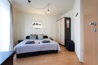 Posteľ alebo postele v izbe v ubytovaní Lucsony Apartman
