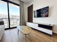 TV a/nebo společenská místnost v ubytování Apartamentos Turísticos Santo Rostro