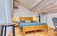 Łóżko lub łóżka w pokoju w obiekcie Maison confortable à Les Lèches avec jardin et terrasse