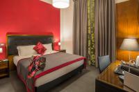 Posteľ alebo postele v izbe v ubytovaní Navona Colors Hotel