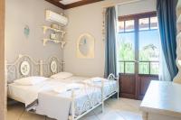 Posteľ alebo postele v izbe v ubytovaní Best Kefalonia villas - charming 3 bedroom villa Gardenia
