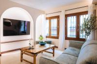 TV a/nebo společenská místnost v ubytování Apartamentos La Vistosona