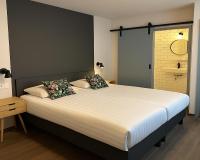 Hotel Hendrickxにあるベッド