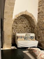 A bed or beds in a room at Le Cinque Pietre
