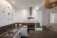 Kuchyňa alebo kuchynka v ubytovaní La Suite Sépia - Superbe appartement Vieux Lyon