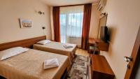 Postel nebo postele na pokoji v ubytování Panorama Family Hotel