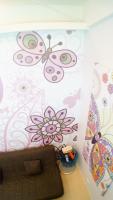 a room with a wall with butterflies on it at Lan Yang Resort Four Seasons in Dongshan