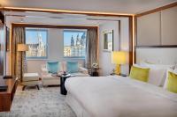 A bed or beds in a room at Kempinski Hotel Corvinus Budapest