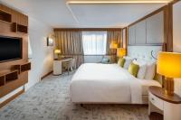 A bed or beds in a room at Kempinski Hotel Corvinus Budapest