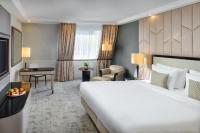 A bed or beds in a room at Kempinski Hotel Corvinus Budapest