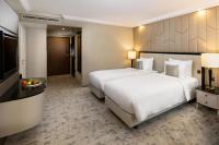 A bed or beds in a room at Kempinski Hotel Corvinus Budapest
