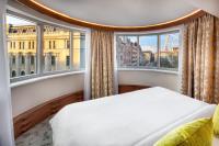 A bed or beds in a room at Kempinski Hotel Corvinus Budapest