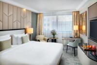A bed or beds in a room at Kempinski Hotel Corvinus Budapest