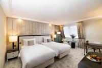 A bed or beds in a room at Kempinski Hotel Corvinus Budapest