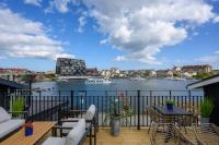 a balcony with a view of a river at Blomlöfs Hotell Saltö in Karlskrona