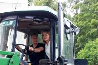 a man and a woman sitting in a tractor at B&amp;B Château de Preuil in Vallenay