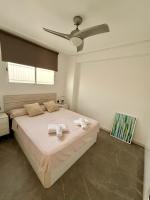 A bed or beds in a room at Apartamento en la Playa Els Terrers 2