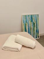 A bed or beds in a room at Apartamento en la Playa Els Terrers 2