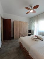 A bed or beds in a room at Sea View Palio Apartment