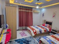 Postel nebo postele na pokoji v ubytování Sidi Beshr Luxury apartment Side Seaview