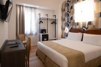 A bed or beds in a room at Hotel Dei Congressi