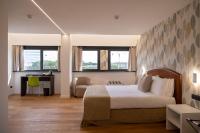 A bed or beds in a room at Hotel Dei Congressi