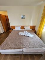 Postel nebo postele na pokoji v ubytování Family Hotel Romantik