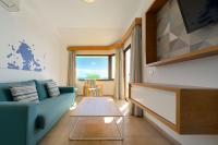 A television and/or entertainment centre at Salt Apartments Reina Sol